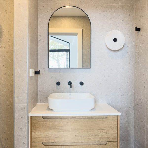 misty terrazzo look porcelain tile in bathroom